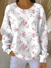 Damen Sweatshirt mit rosafarbenem Blumenmuster zum Thema Brustkrebs